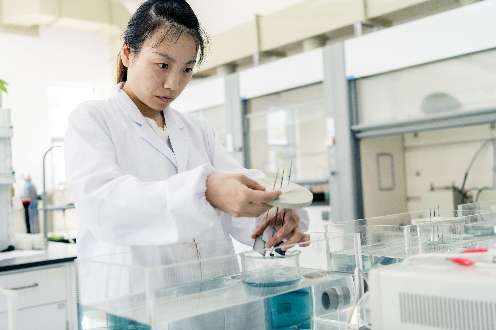A lab technician tests water at the Eco-Sanitary Manufacture Co. facility at the Yixing Industrial Park of Environmental Science and Technology in Yixing city, Jiangsu Province, China