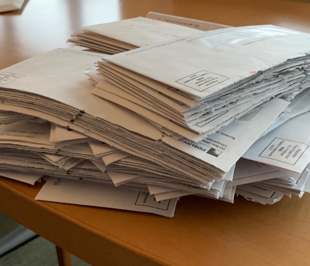 A stack of mail on a desk