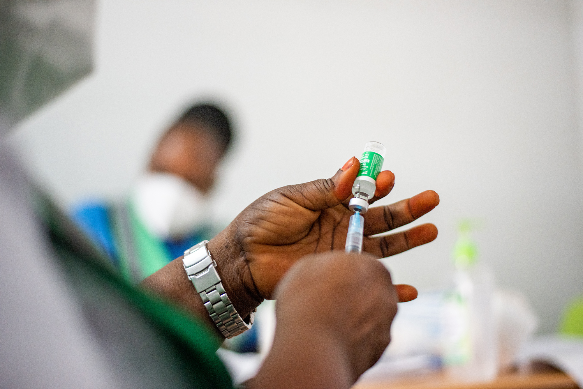 A health worker prepares the COVID-19 vaccine at the Abuja National Hospital in Abuja, Nigeria on March 5, 2021.