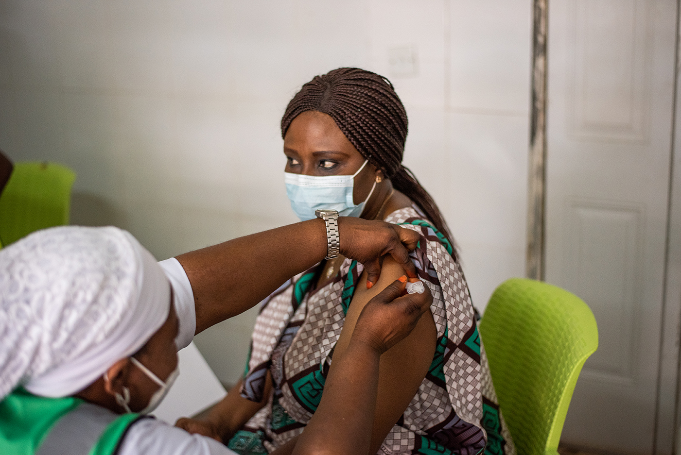 Health worker, Morgan R. E., receives the COVID-19 vaccination as part of the effort to vaccinate. Frontline workers at the Abuja National Hospital in Abuja, Nigeria on March 5, 2021.