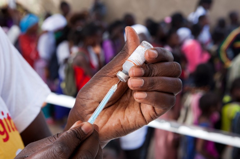 A health worker prepares a vaccine during a meningitis vaccination campaign in Kaolack, Senegal.