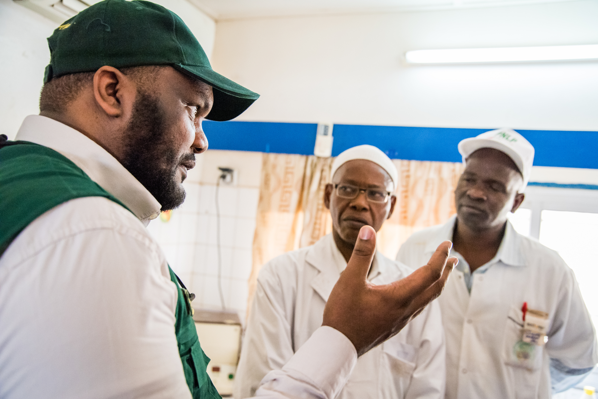 Abdullah Al Ruwaili, Director of Humanitarian Aids Management at the King Salman Humanitarian Aid and Relief Center talks with health workers in the laboratory where malaria is identified under microscope at the Deggo Health Centre in Pekine, Dakar, Senegal on March 13, 2017. The impact committee of the Lives and Livelihoods Fund (LLF) visited the center to learn more about the fight against malaria. 