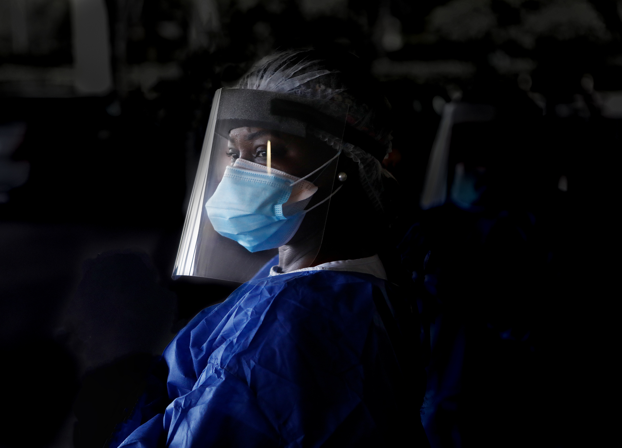 A medical professional wearing protective equipment