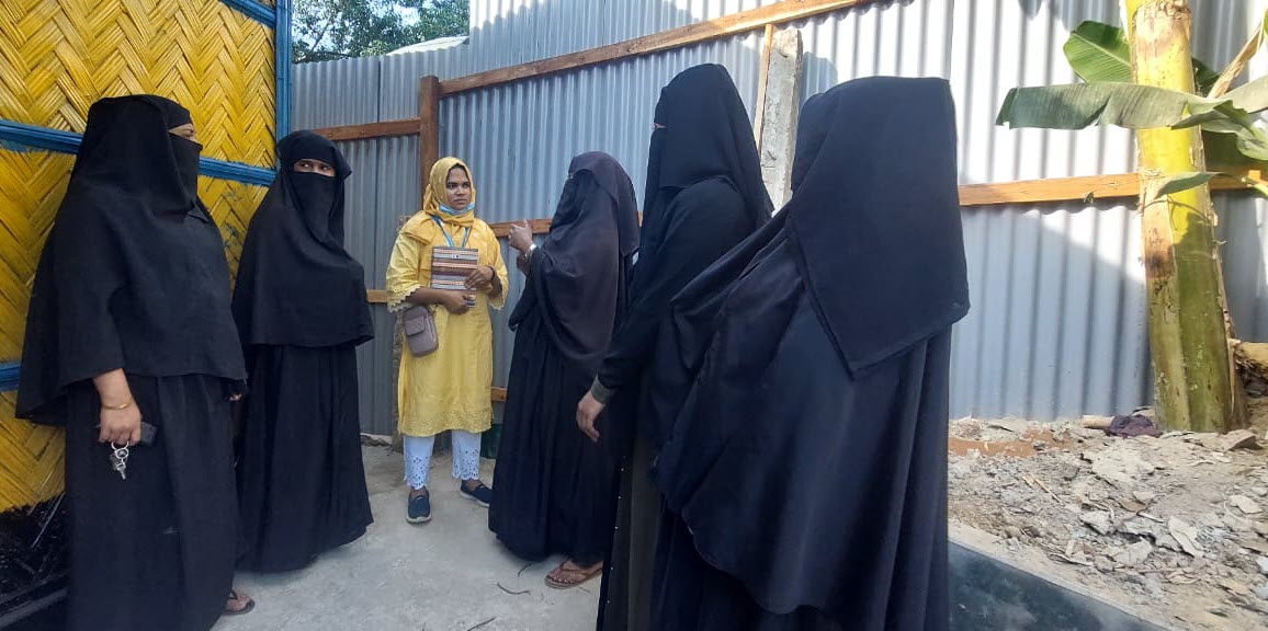 Women stand outside a Women’s Hygiene Center near Cox’s Bazar  Credit: UNHCR
