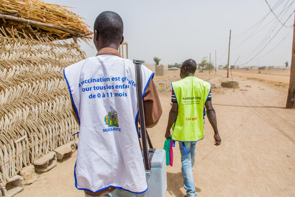 Amadou and Aboubaka, certified vaccinators walk door to door to reach children in the Zokokladdio district during a polio vaccine campaign in Maroua, Cameroon on March 2, 2018.